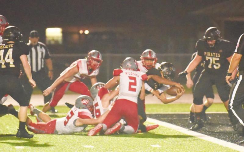 Pirate QB Quinten Root stretches to score a TD for the Pirates.