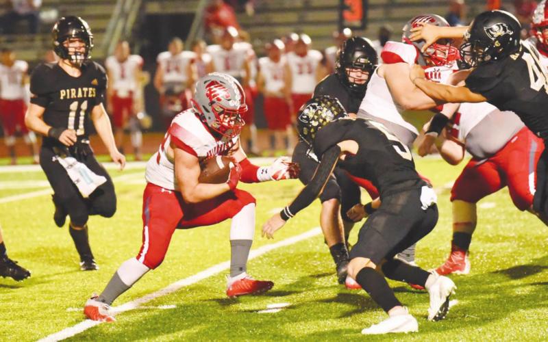 Dylan Dial #5 comes up to stop Wildcat RB Zane Obregon.