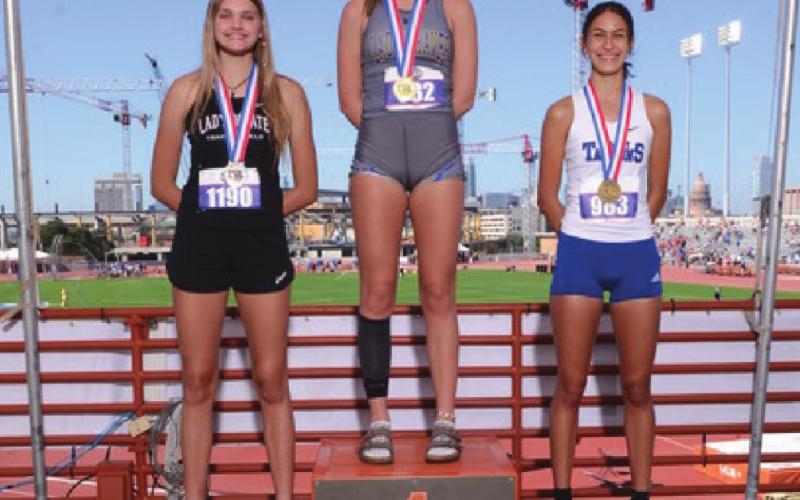 Vidor Lady Pirate Freshman Raegan Stephenson was awarded a silver medal in 4A competition at the State Track Meet Thursday in Austin for her leap of 5’4”. Also pictured are Brenna Bottoms, senior, Nevada Community School, who took first place with 5’5’ and third place medalist Madison Ramos, junior, Port Isabel, 5’4” Photo courtesy of Jeffrey Bishop