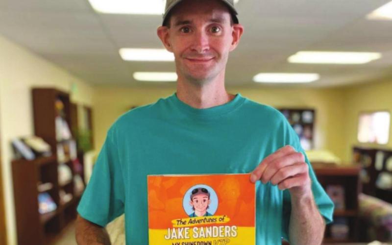 Sanders pens book for charities