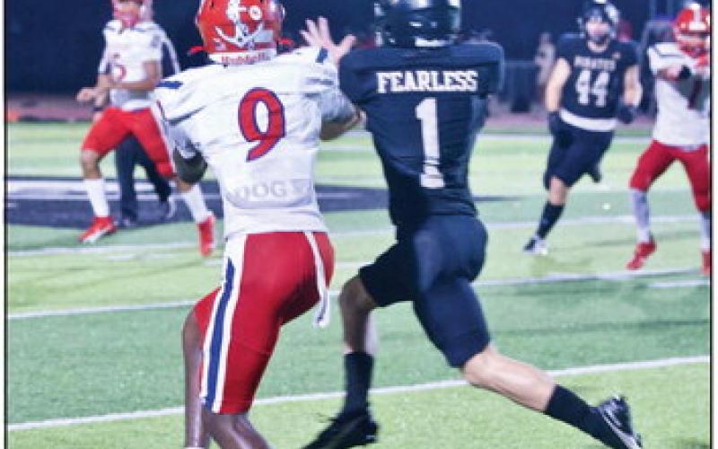 Westin Baker intercepted this ball on the run and sprinted 70 yards for a touchdown against the Exporters Friday in Vidor. Photo by Randall Luker