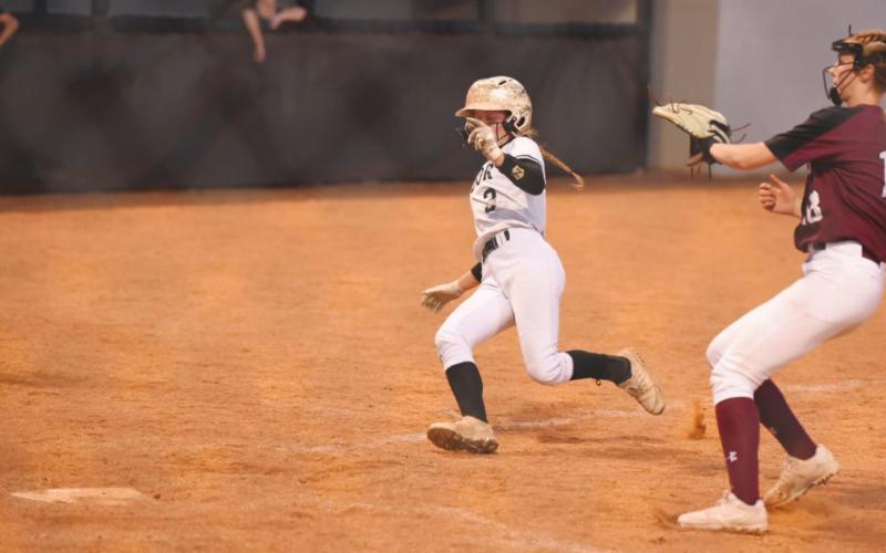 Skyler Head beats the throw at home in Tuesday’s game versus the Silsbee Lady Tigers.