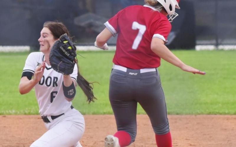 Varsity Lady Pirate Brooklyn Bushelle stretches to make the play at first base in Friday’s home game versus Bridge City.