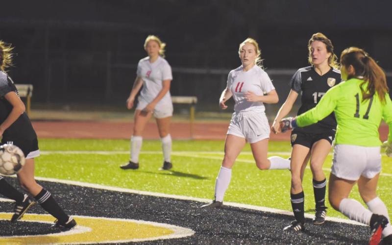 Lady Pirate #17 Amelia Wright watches as her kick heads for score against the BC Lady Cardinals Tuesday.