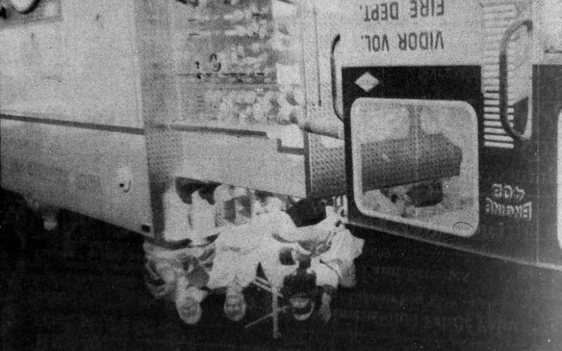 Santa Claus rides atop the Vidor Volunteer Fire Department's Engine 409 during the annual Christmas parade Saturday. While he was out of reach of children during the parade, he met a lot of them during the Christmas tree lighting later that evening