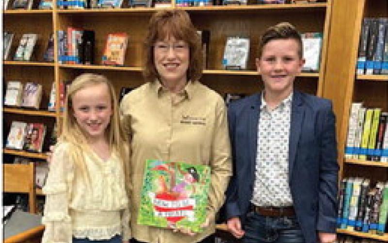 Pine Forest students Caddi Gibbs and Brody Miller honored School Board Member Gina VanDevender.