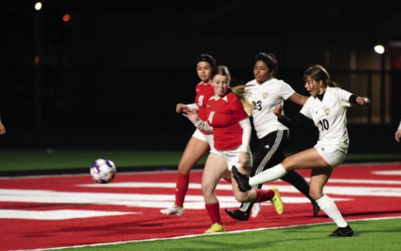 Gracelen Simmons, #10, sends the ball in for a score in the junior varsity match against Bridge City Friday. Photo by Randall Luker