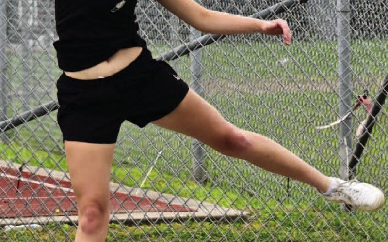 Lady Pirate Madison Powell won the district championship in the girls discus event Monday at West Orange. Photo by Randall Luker