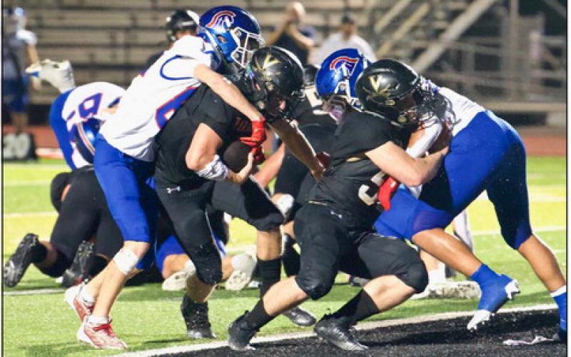 Isaac Fontnow scores a touchdown behind the blocking of Pirate lineman Brooklyn Freeman. Photo by Randall Luker