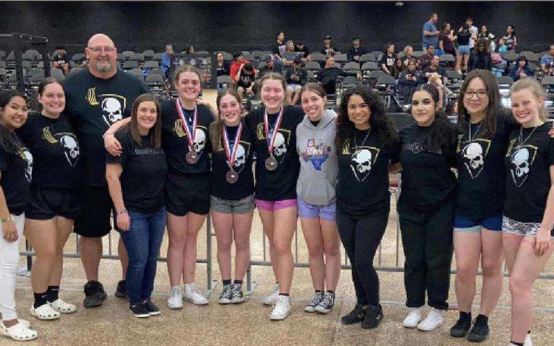 Coach Rodney Burks with girls power lifting team. Photos by Randall Luker