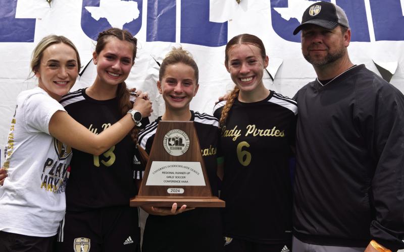 2024 Senior Lady Pirates The three seniors on the 2024 Lady Pirate Soccer team hold the Regional Runner-Up Trophy with (left to right) Assistant Coach Ciera Tinkle, Jillian Allen, Hope Dilley, Railei Mouton and VHS Head Girls Soccer Coach Ralph Fields.