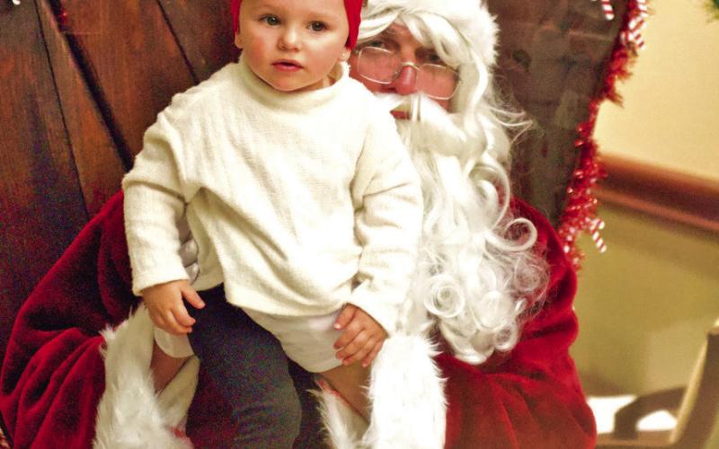 Special Time With Santa Santa Claus greeted and listened patiently as children enjoyed their special time during the Light Up City Hall event Friday during Vidor Hometown Holidays celebration.