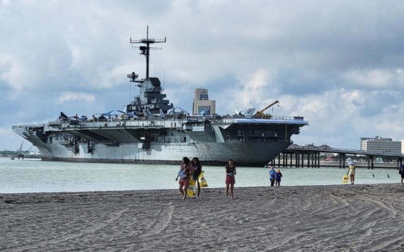 Volunteers help clean up a beach near the U.S.S Lexington Museum in Corpus Christi, Texas. Courtesy Photo
