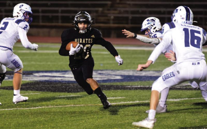 Pirate RB Daigan Venable runs through a host of Eagle defenders Friday. Photo by Randall Luker