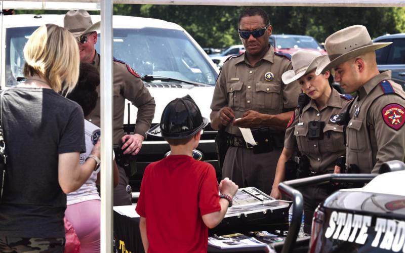 Sergeant Richard Standifer and Troopers Alt, Arauz and Salinas manned the Texas Department of Public Safety booth at the Cops N Kids event answering questions, handing out pamphlets and interacting with parents and kids.