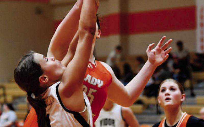 Kinley Goodwin is fouled as attempts a shot in the Lady Pirates game versus Orangefield.