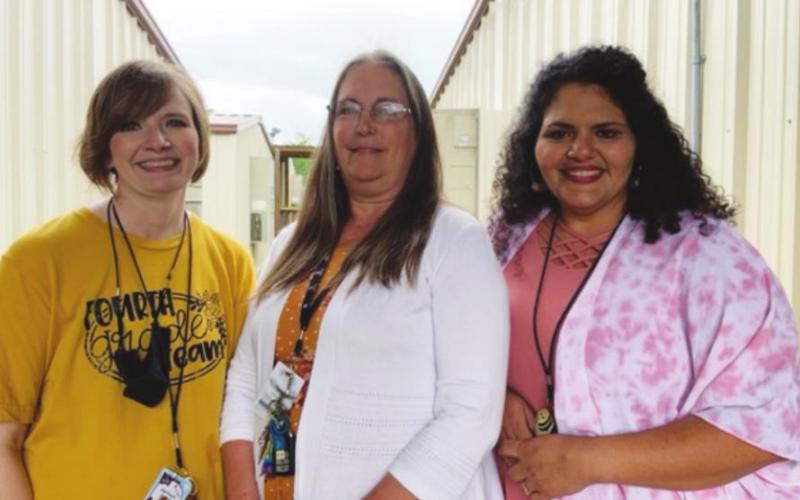 Here are Mrs. Bradley, Mrs. Taylor, and Mrs. Burns. Poor Mrs. Gill broke her hand at school Wednesday, and is on her way to the Fondren Clinic.