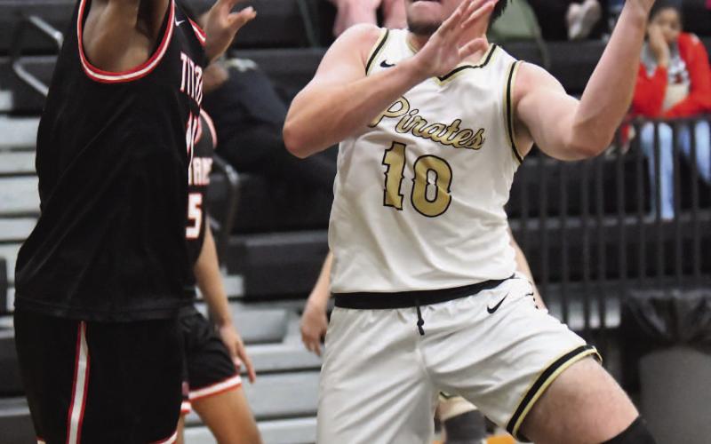 Camden Young attempts a one-handed under the basket.