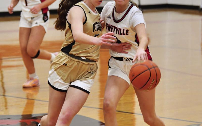 Hadlie Jackson moves in for a steal against Deweyville Friday.