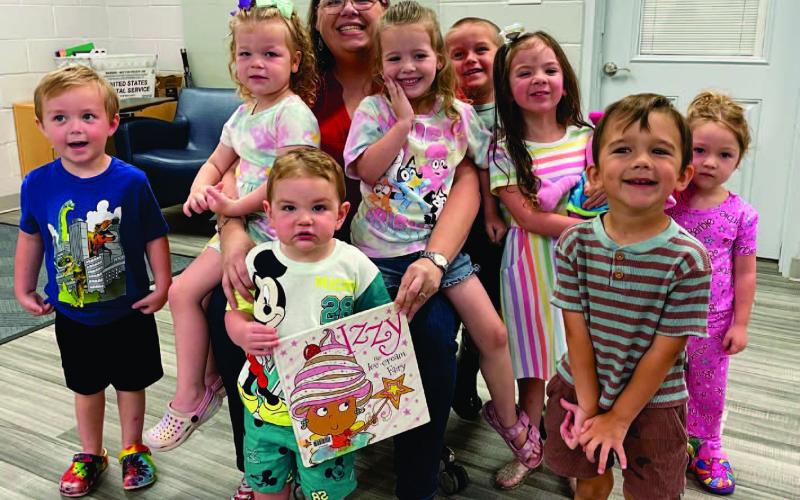 The Vidor Public Library held the last Itty Bitty Storytime for 2024-2025. Library clerk Sarah Screws read “Izzy the Ice Cream Fairy “by Tim Bugbird. “Izzy and her friends run a magical ice-cream stall on the beach, until one day they discover that their ice-cream well has run dry. The friends travel to a new land in search of more delicious ice cream.” The children colored wooden ice cream cut-outs for the craft and enjoyed making ice cream for their treat.