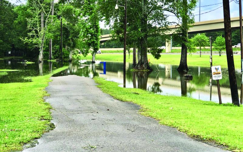 Afternoon and overnight thunderstorms brought damaging winds to portions of Orange County but the Vidor area mostly experienced minor flooding. The Claiborne Park’s walking track is partially underwater in the photo taken Tuesday afternoon. Photo by Randall Luker