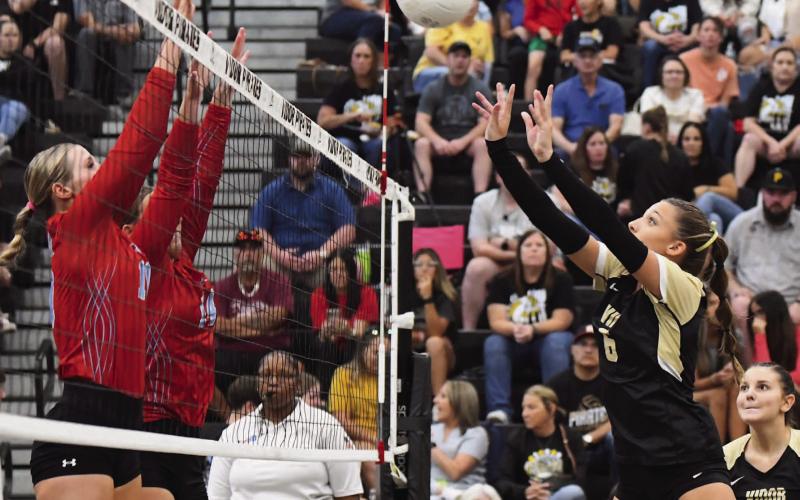 Lady Pirate Paislee Miller returns the ball in Friday night’s loss to Lumberton.