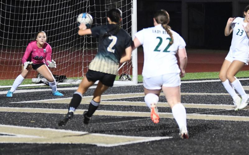 Taylor Bull scores against Little Cypress Friday.