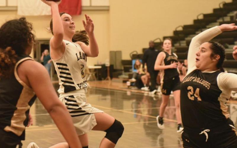 Lady Pirate Jana Baters tries for a layup against Nederland Tuesday.