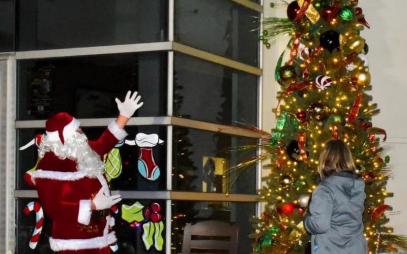 Santa and Mayor light the town Christmas tree during this year's annual Hometown Holidays celebration. Photo by Randall Luker