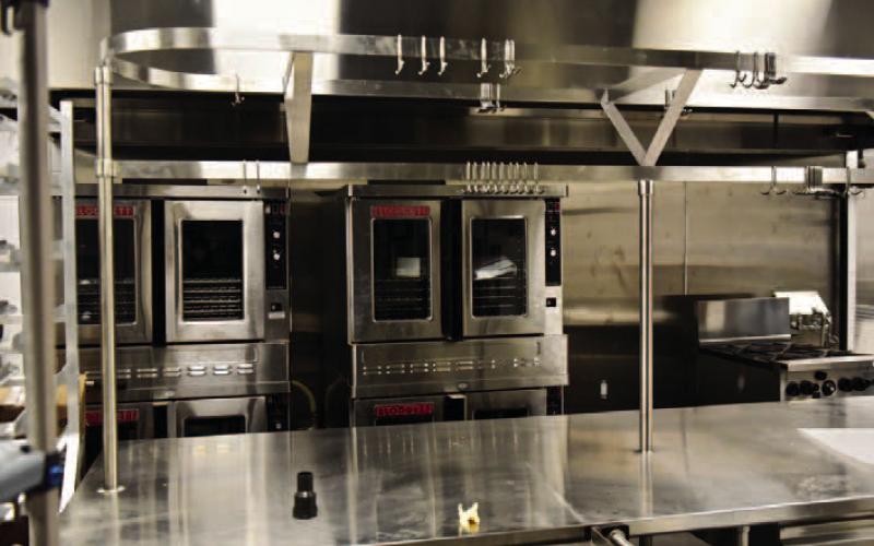 Stainless commercial kitchen appliances fill the school’s kitchen with prep tables, freezers ovens, coolers, ice machines, mixers and other items awaiting the start of school Jan. 9.
