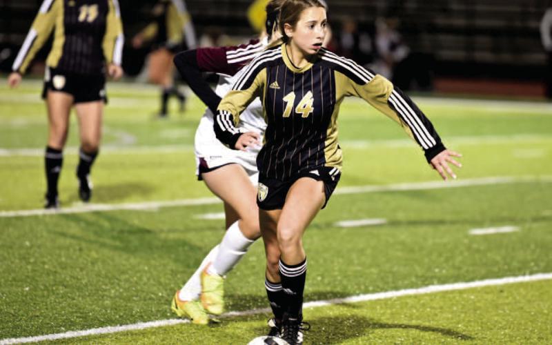 Michaela Droptini dribbles past a Silsbee defender. Photo by Randall Luker