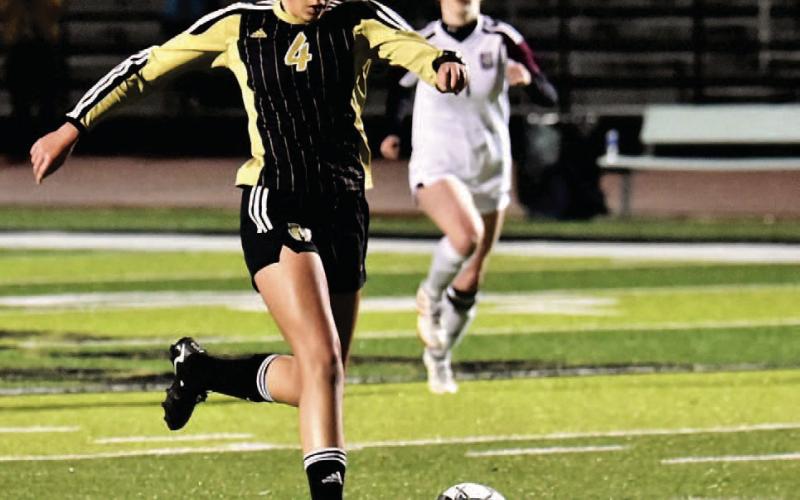 Varsity Lady Pirate Kenya Correia kicks a goal versus Silsbee in the Lady Pirates initial district game. Photo by Randall Luker