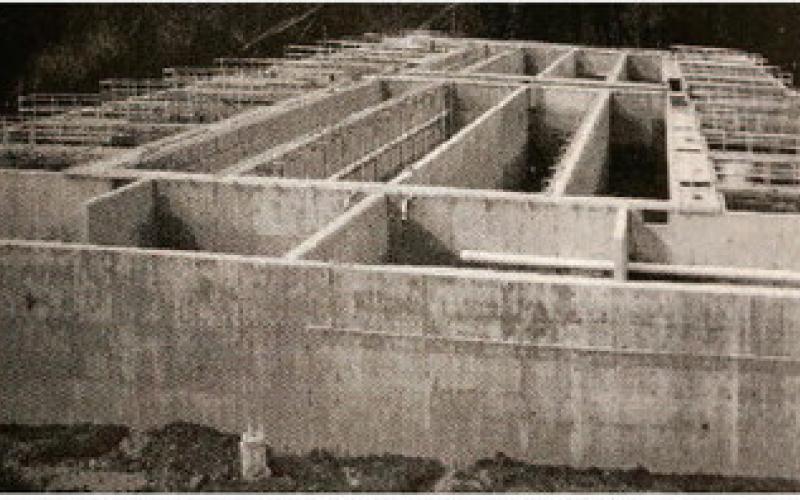 The football field sized AeroMod wastewater treatment unit dominates the Water District's new state-of-the-art wastewater treatment plant under construction at the site of the current operating Oaklane wastewater treatment plant. The multi-chambered, 150-foot by 300-foot reinforced concrete structure has sixteen foot tall walls some of which are sixteen inches wide.
