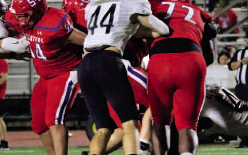 Jason Watson and Tate Ardis fight to bring down a Brazosport runner  Madlynn Magnuson photo courtesy of VISD