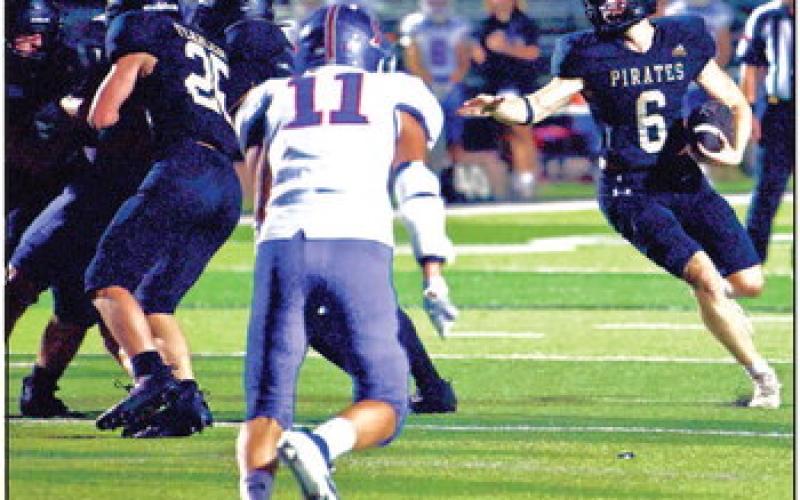 Dane Villadsen cuts back to an open running lane in Friday’s 48-3 blowout win over the TCA Trojans. Photo by Randall Luker