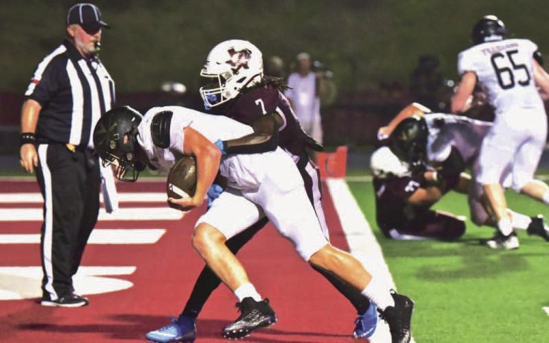 Cashing in on Villadsen’s big run, Isaac Fontnow carried the ball and a Silsbee defender over the goal line for the Pirates’ first score. Photo by Randall Luker