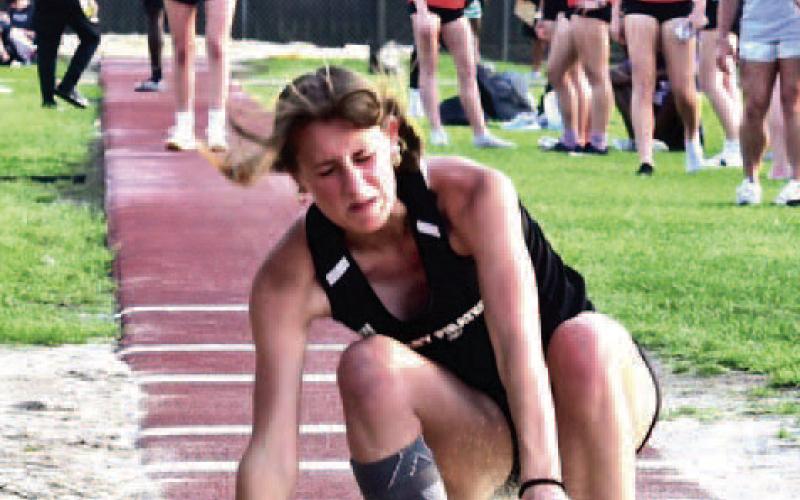 Sand flies as senior Lady Pirate Jaden Lee makes her landing in the Triple Jump event at Thursday’s VHS Invitational Track Meet. Lee took first place in the event with a leap of 35’ 10.75”. Vidor Track and Field athletes will be in competition next in Anahuac at the Gid Campbell Relays March 23.. Photo by Randall Luker