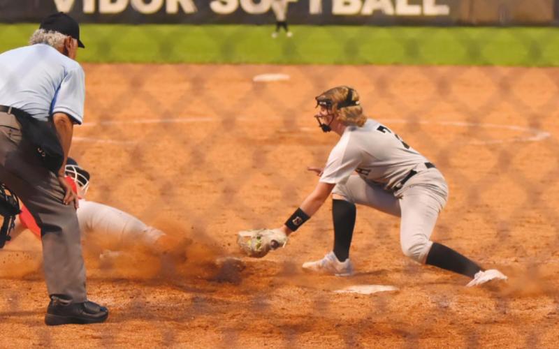 Natalie Morrison stops the steal at home plate in Friday’s home game versus the Lady Cardinals.