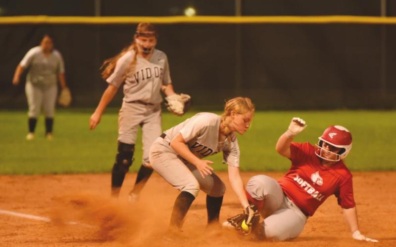 Maddison Johnson makes the tag at third in the Lady Pirate jv game with Bridge City Friday.