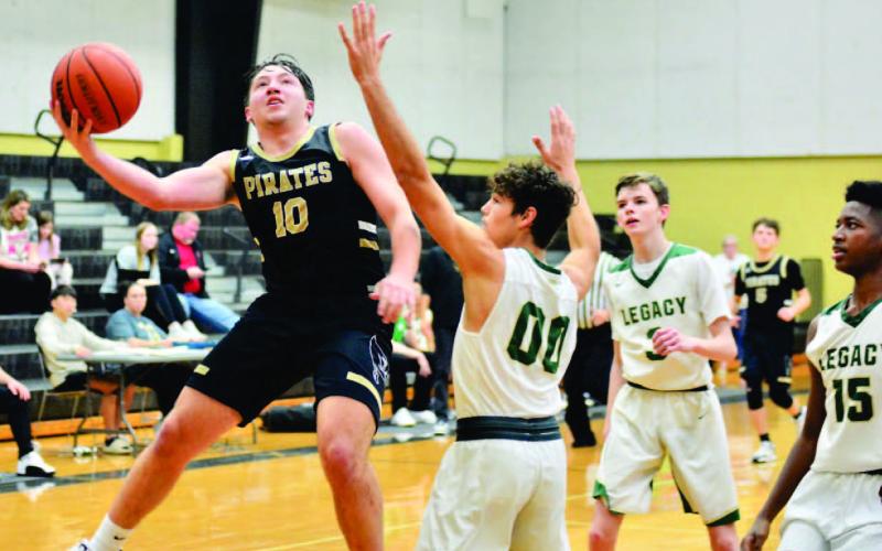 Camden Young scores in the Legacy game Saturday in Nederland.