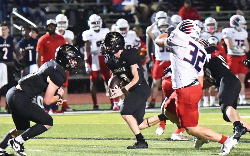 Landon Jones breaks into the open as Brody Bloss prepares to block his pursuer.