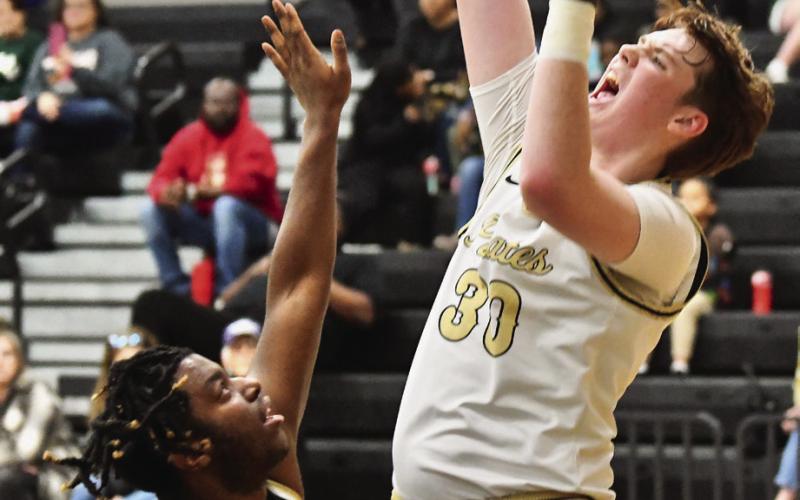 Colton Callahan shoots for two over the Bear defense.