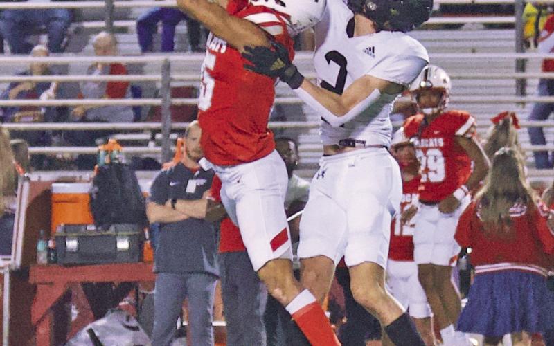 Blake Richards deflects a Wildcat pass that was intercepted by teammate Aiden Villafano in Friday’s game at Splendora.
