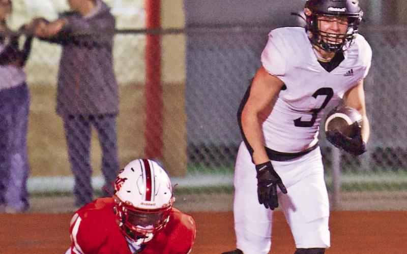 Isaac Fontnow grins after pulling in a touchdown pass in the end zone in the Pirates’ 55-6 victory over the Splendora Wildcats Friday in Splendora.