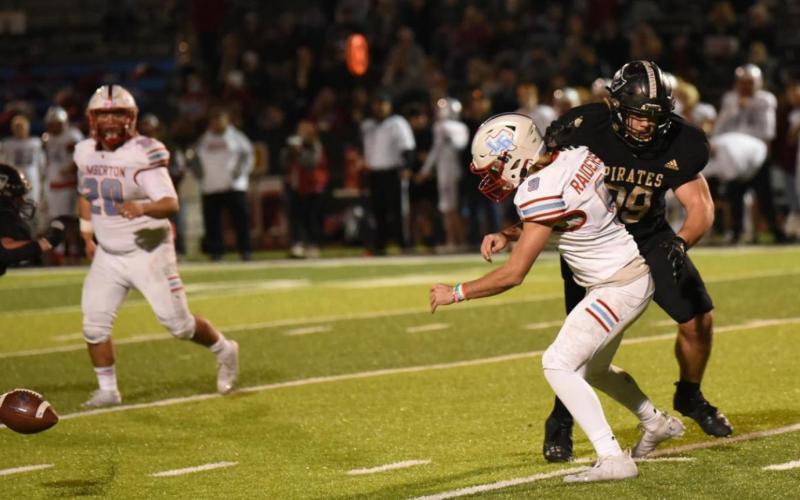Photo by Randall Luker Jordan Smith harries the Raider QB as the ball comes loose.