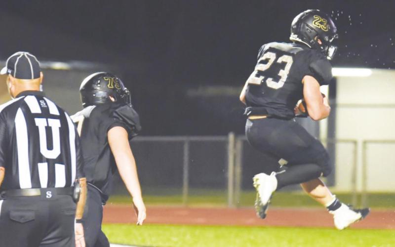 Trenton Conn jumps for joy as he scores the game winning overtime touchdown versus Brazosport Friday.