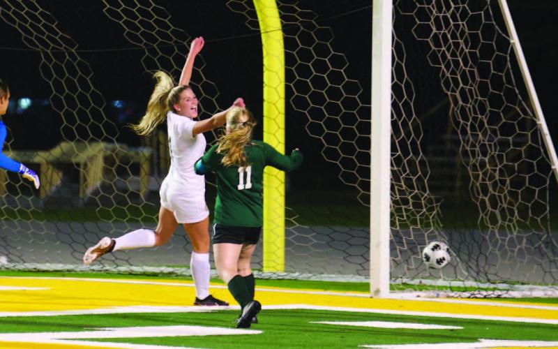 Quincy LaPray celebrates her third goal of the night in the junior varsity Lady Pirates’ 6-0 win over the LCM Lady Bears Friday. Photo by Randall Luker