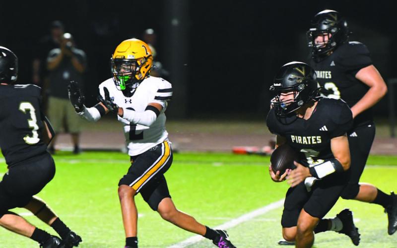 Pirate Quarterback Daigan Venable outran and outmaneuvered the Liberty defense to score on a 31-yard sprint to the end zone.