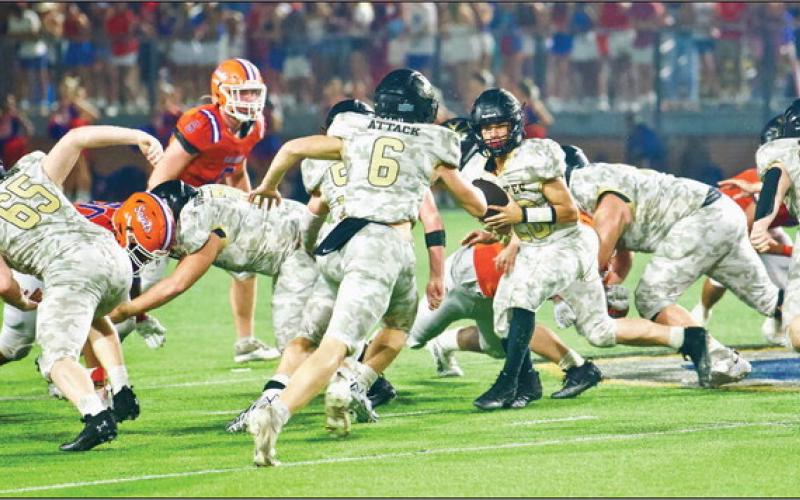 Pirate QB Daigan Venable hands the ball off to #6 Dane Villadsen as #65 Blane Ragan other unidentified linemen and #26 Riley Marlow block. Photo by Randall Luker