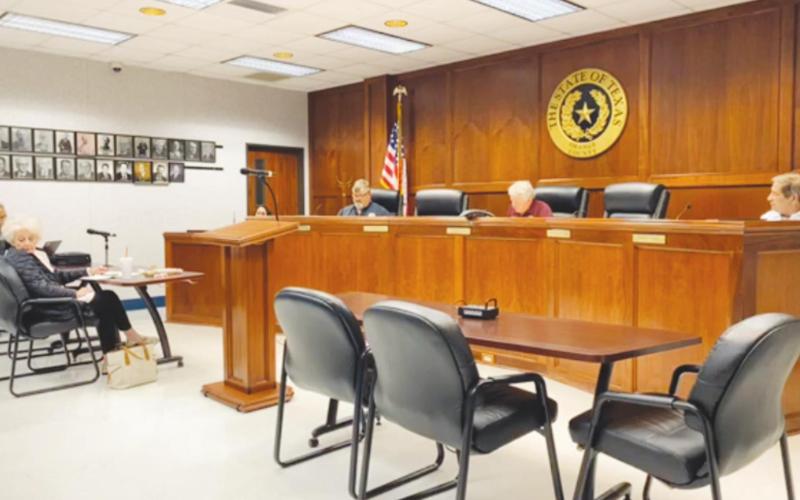 The Orange County Commissioners’ Court, seen here practicing social distancing back in April of this year, voted unanimously last week to invoke a special clause of Senate Bill 2 that will allow Orange County to file for special taxing unit status in order to bypass the new law’s three and a half percent property tax increase cap when the Court sets a proposed 2020-2021 tax rate this week.